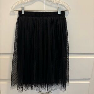 Black mini skirt with mid length lace overlay.